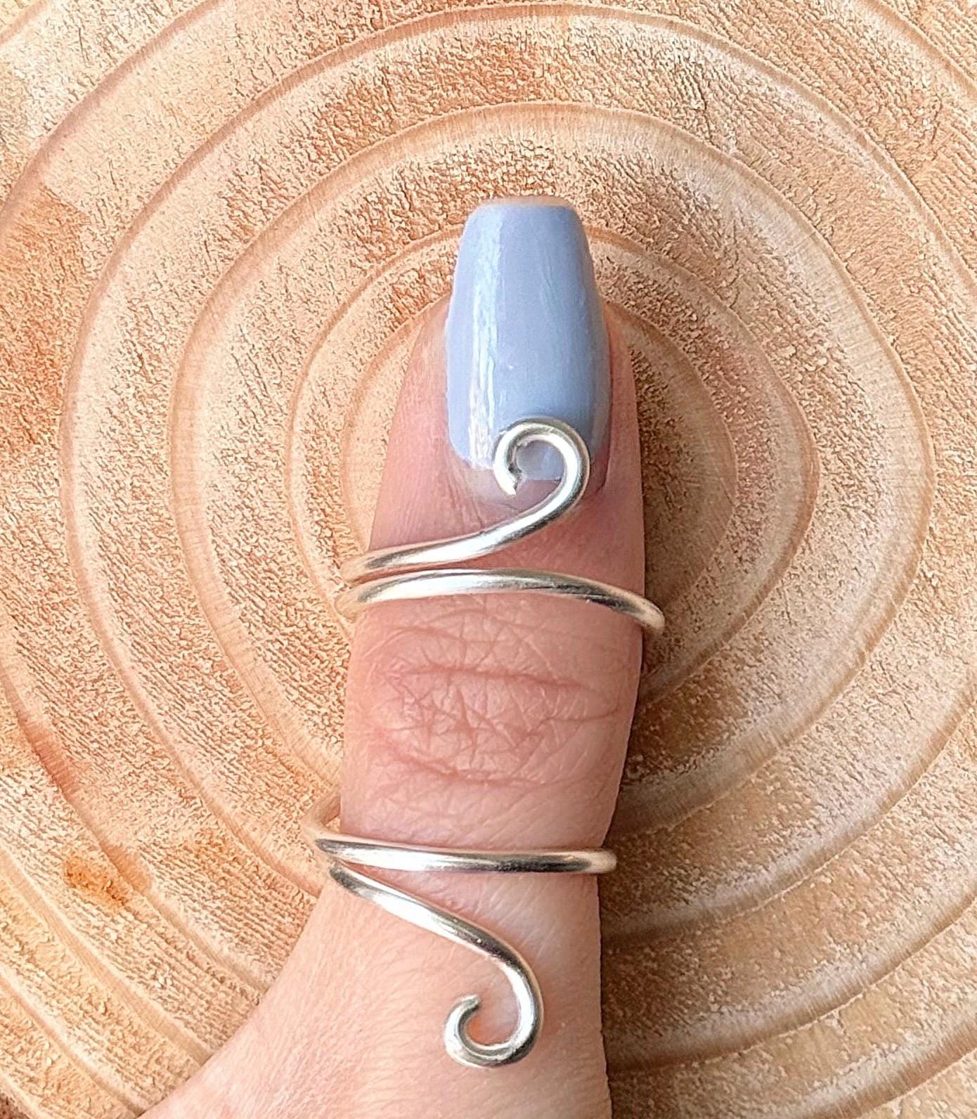 The Azalea thumb ring splint, handmade by Evergreen Ring Splints