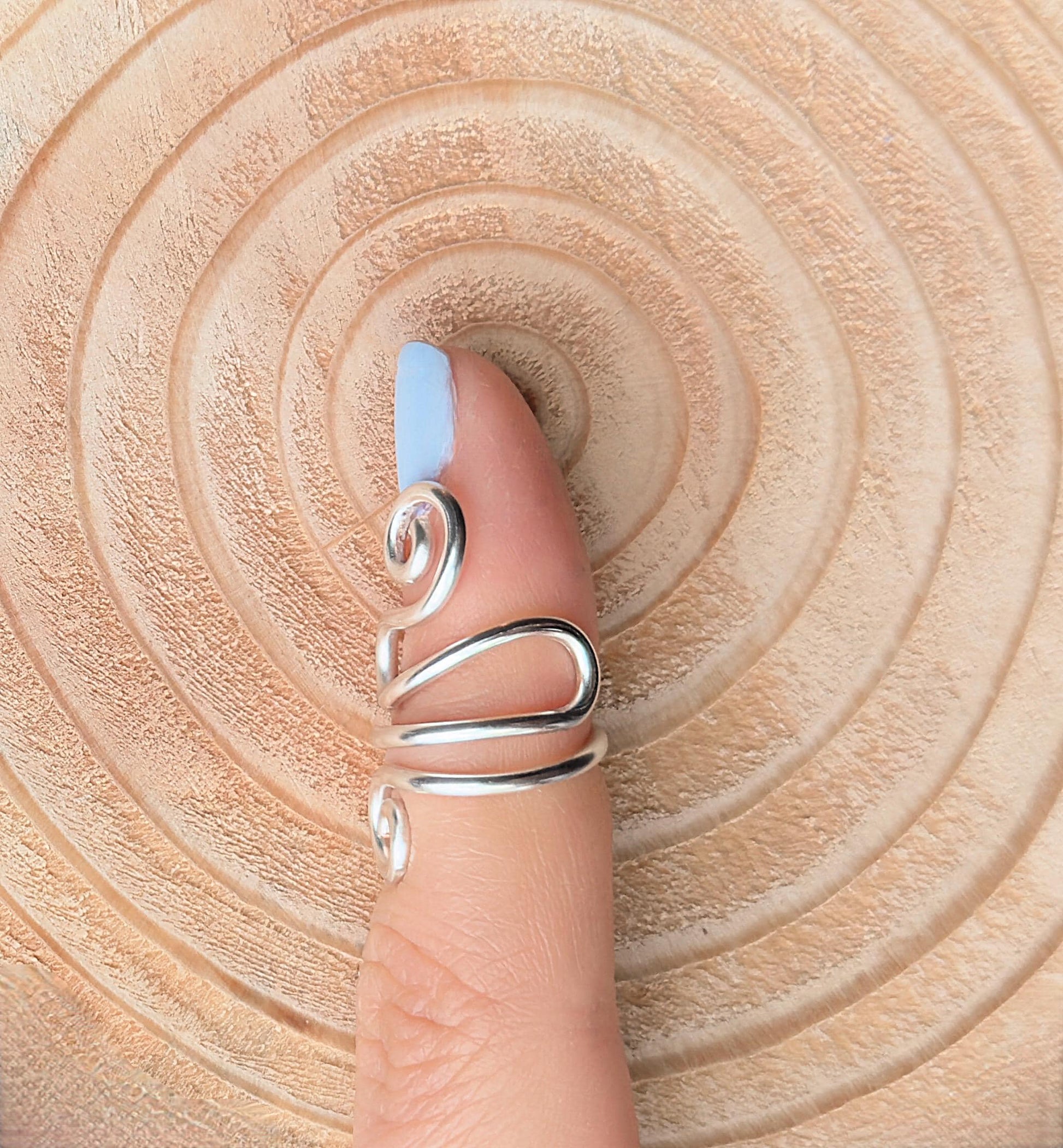The Peony crochet yarn guide ring splint, handmade by Evergreen Ring Splints