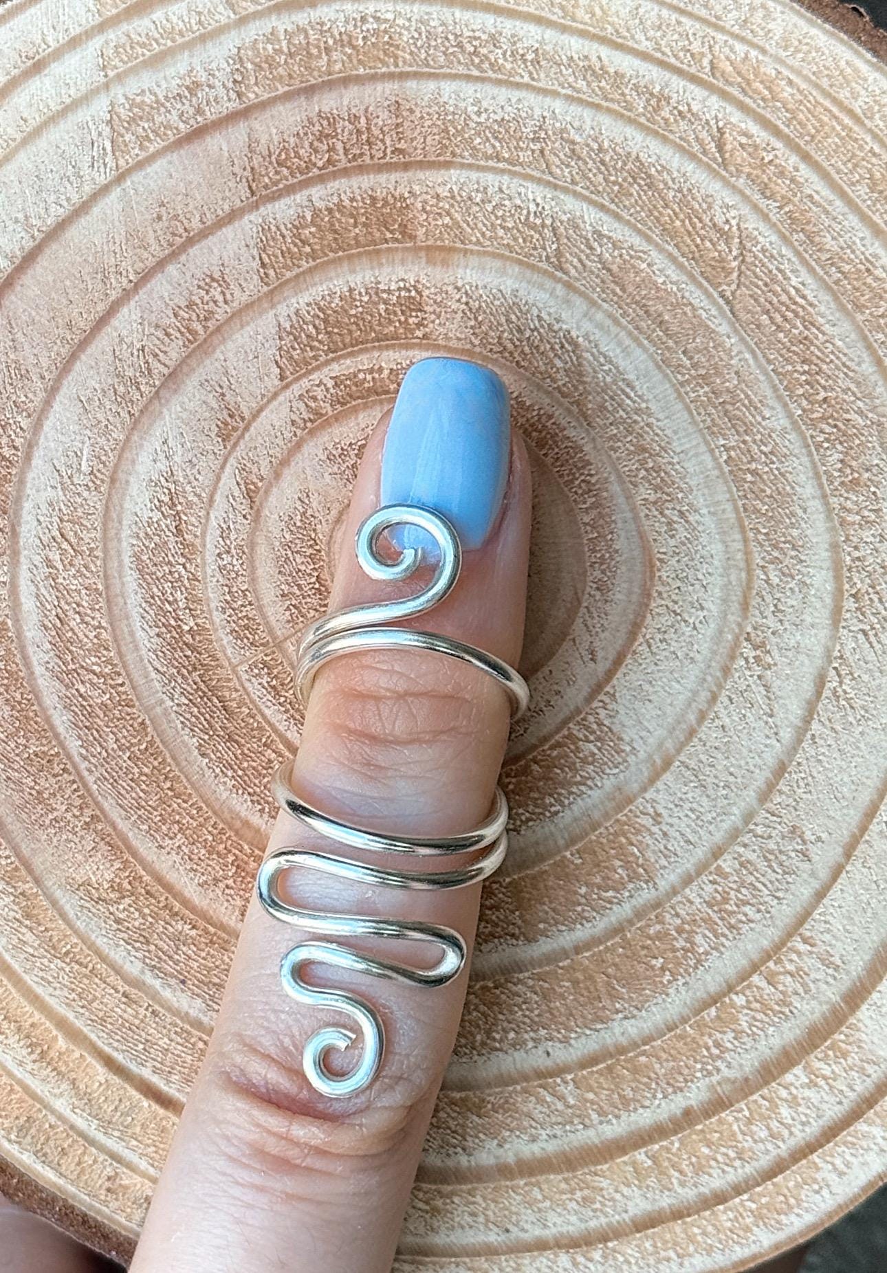The Fuchsia swan neck ring splint, handmade by Evergreen Ring Splints