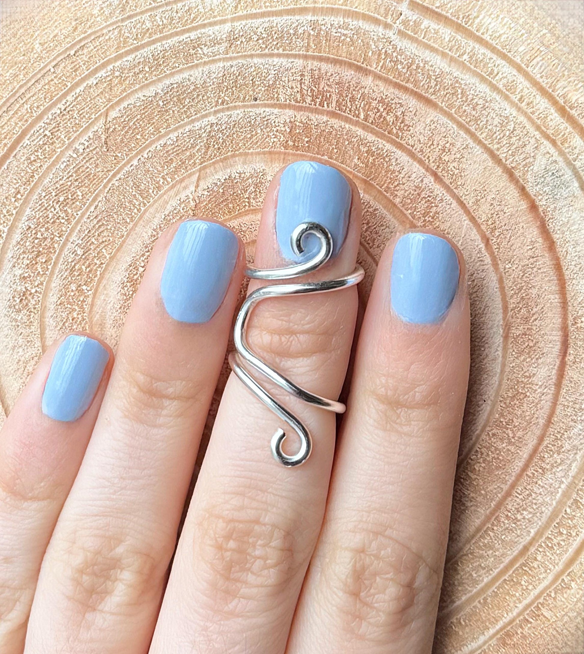 The Daisy lateral deviation ring splint, handmade by Evergreen Ring Splints