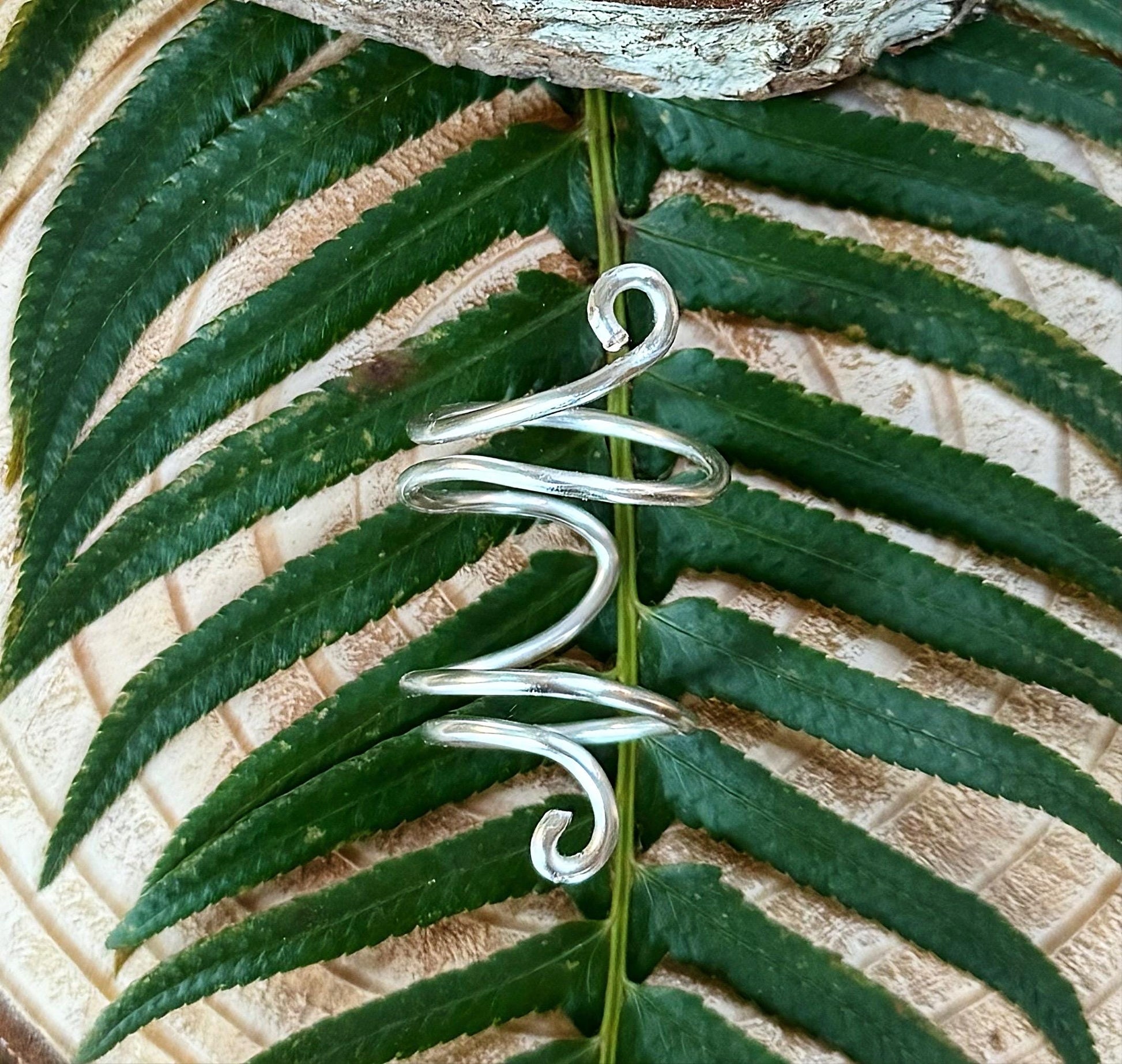 The Azalea thumb ring splint, handmade by Evergreen Ring Splints
